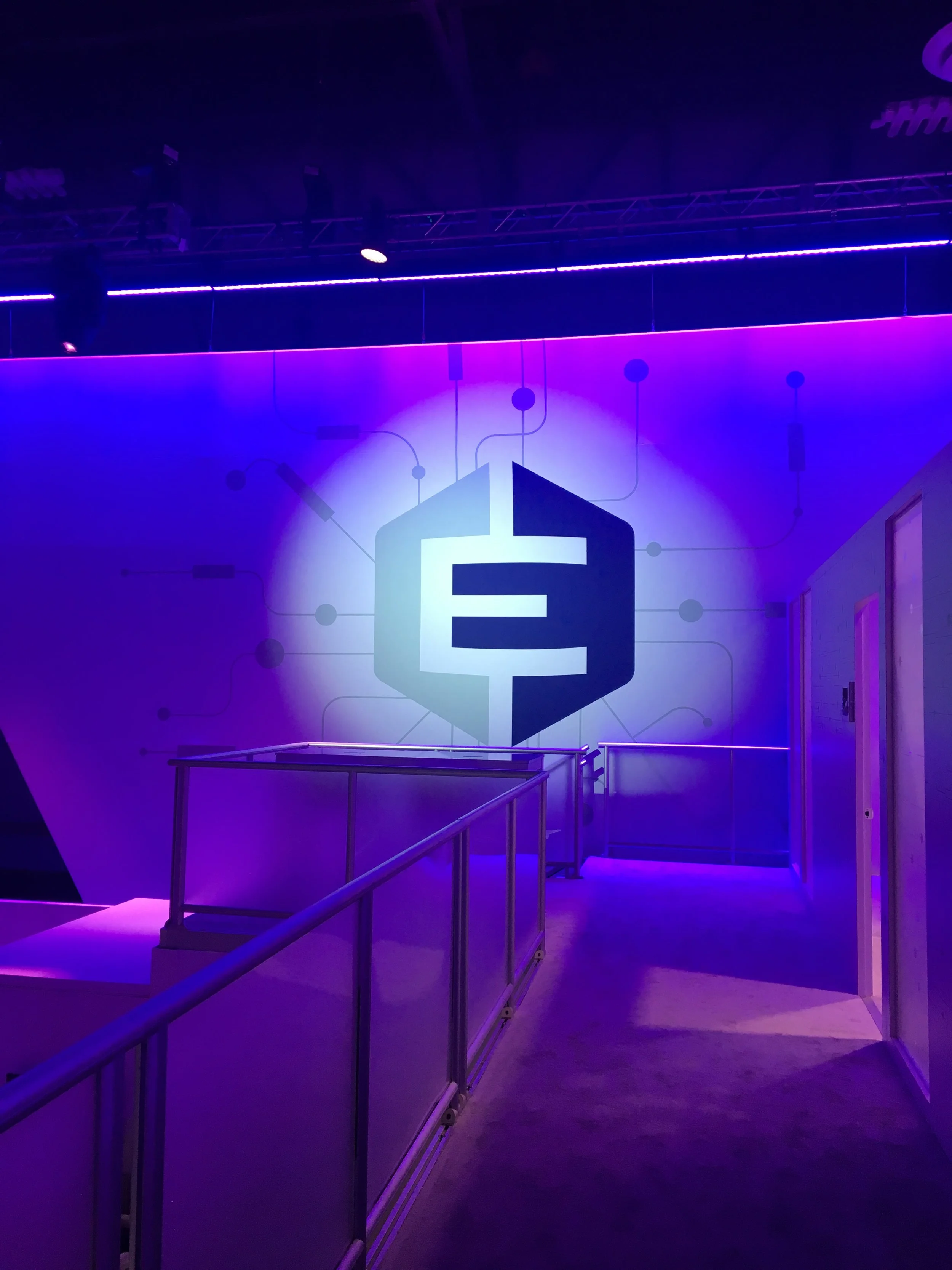 Everi G2E 2017 booth — hexagonal logo wall lit purple