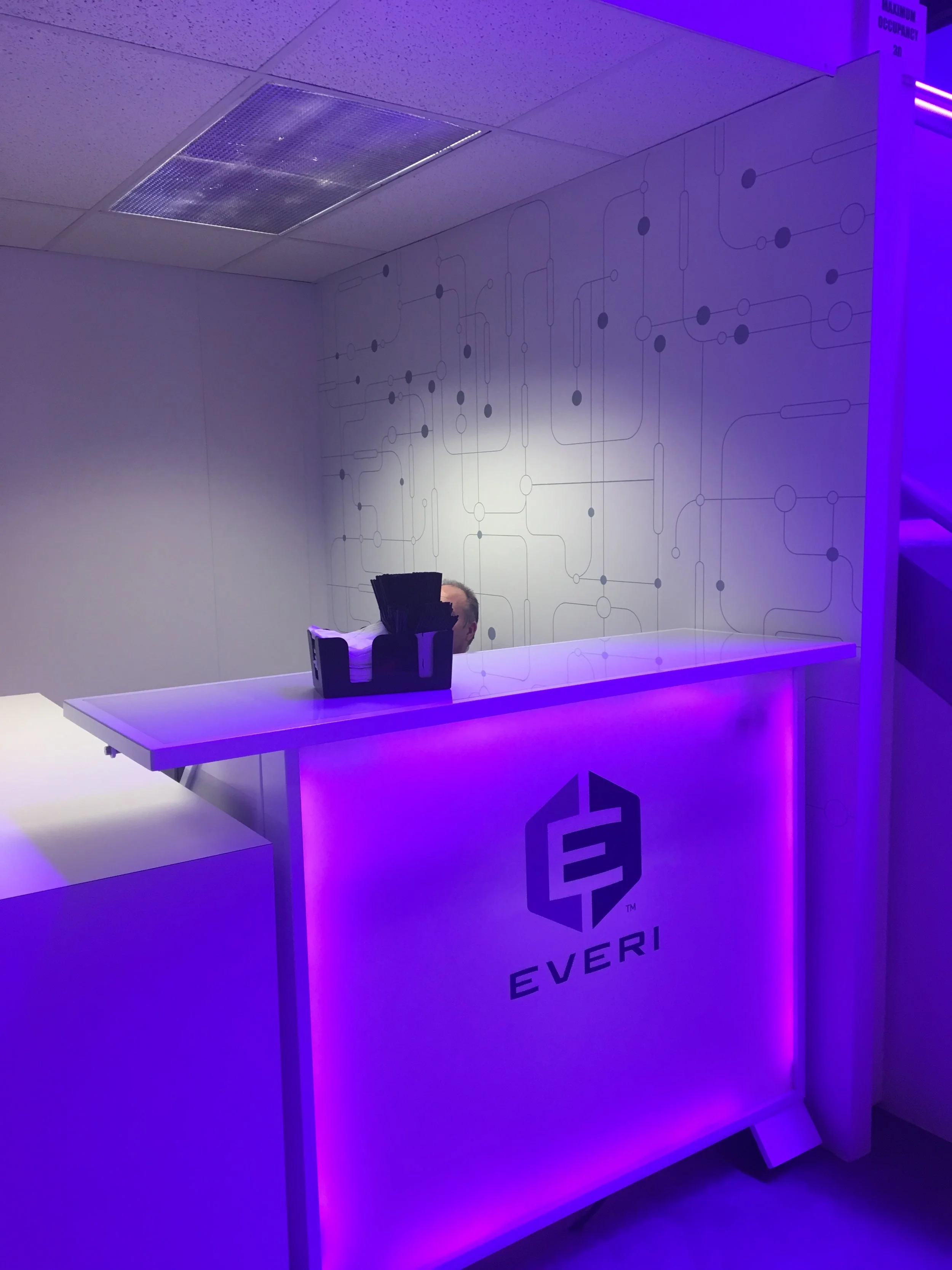 Everi G2E 2017 booth — illuminated reception counter